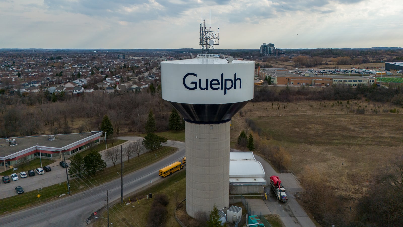 An aerial view of the Guelph water tower with the surrounding streets and school field