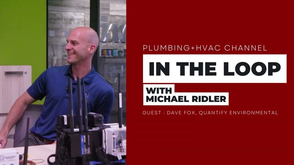 Dave Fox with monitoring hardware on the table during the Plumbing and HVAC Magazine interview